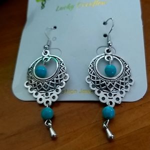 Two new pair of fashion earrings  plated settings with turquoise color stones.